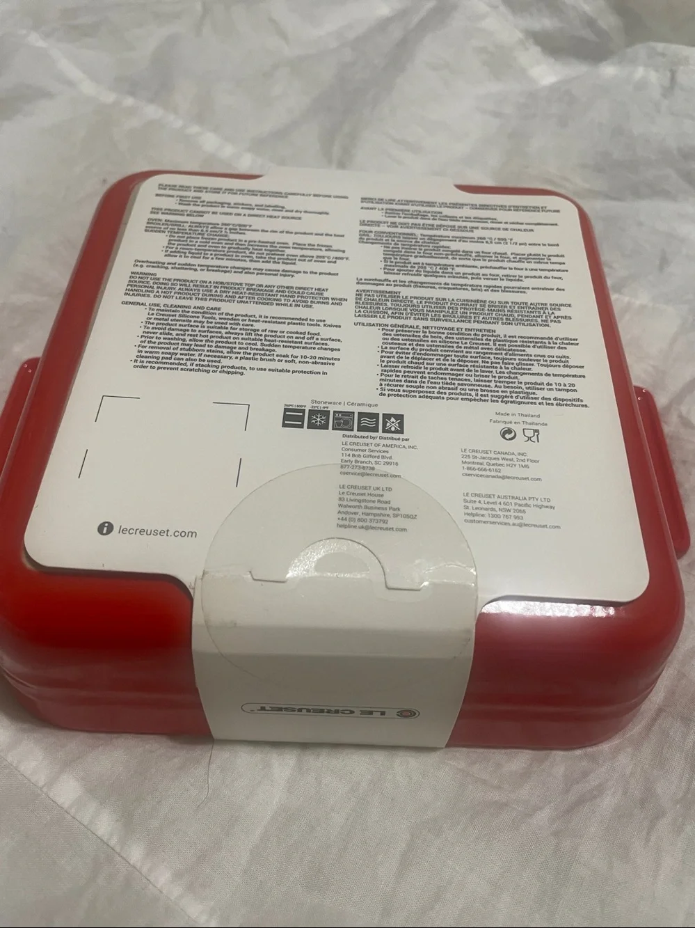 Brand New Le Creuset 5 1/2” square red baking dish that holds 20oz